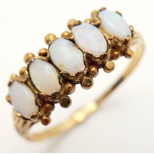 35 - Impressive Vintage 9 carat GOLD and OPAL RING. Having a sweep of 5 x FIRE OPALS mounted to top. Full... 