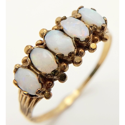 35 - Impressive Vintage 9 carat GOLD and OPAL RING. Having a sweep of 5 x FIRE OPALS mounted to top. Full... 