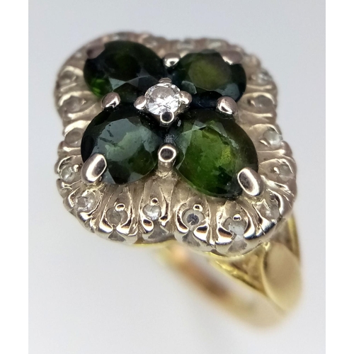 91 - A magnificent 18 carat GOLD RING having DIAMONDS and GREEN DIOPSIDE GEMSTONES mounted to top. Fully ... 