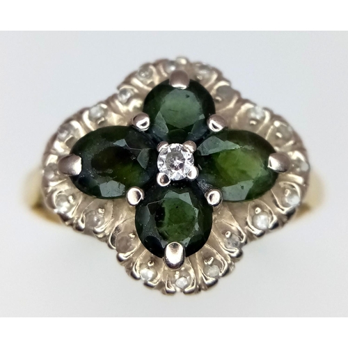 91 - A magnificent 18 carat GOLD RING having DIAMONDS and GREEN DIOPSIDE GEMSTONES mounted to top. Fully ... 