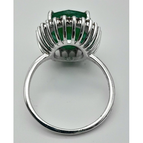 156 - A 6ct Emerald Gemstone Ring with Diamond Accents. Diamonds -  approx 0.45ctw. Set in 925 Silver. Siz... 