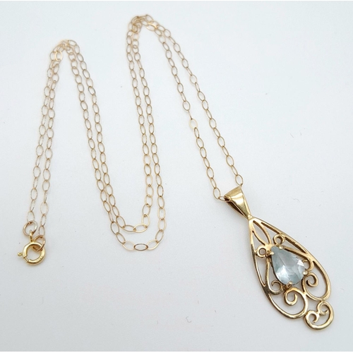 338 - A 9K Yellow Gold Blue Pendant on a 9K Yellow Gold Disappearing Necklace. 3cm and 40cm. 1.37g