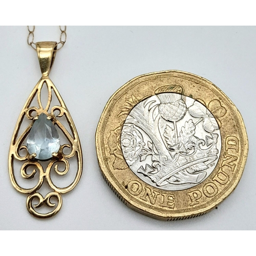 338 - A 9K Yellow Gold Blue Pendant on a 9K Yellow Gold Disappearing Necklace. 3cm and 40cm. 1.37g