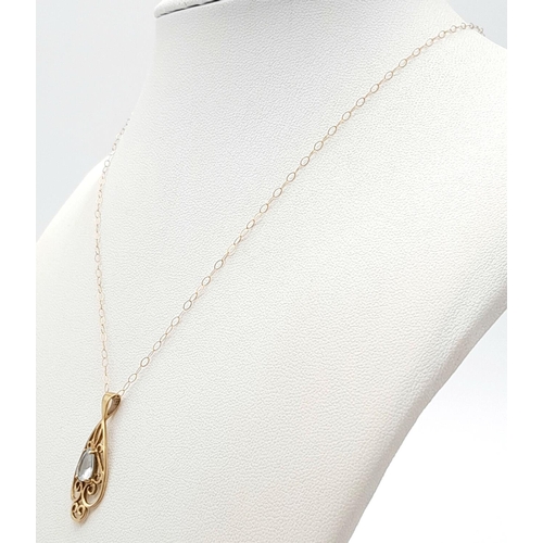 338 - A 9K Yellow Gold Blue Pendant on a 9K Yellow Gold Disappearing Necklace. 3cm and 40cm. 1.37g