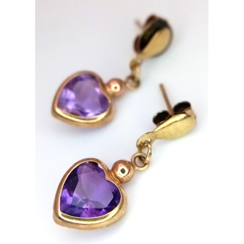 612 - A Pair of 9K Gold and Amethyst Earrings.