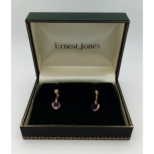 612 - A Pair of 9K Gold and Amethyst Earrings.