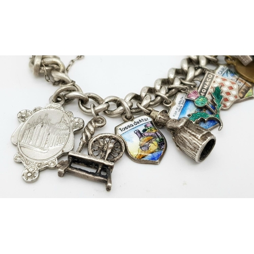 651 - Vintage SILVER CHARM BRACELET. Complete with safety chain . Silver charms from around Europe to incl... 