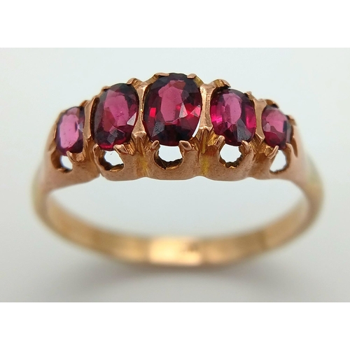 728 - Impressive 9 carat GOLD RING having 5 x RED GEMSTONES oval cut and Mounted to top. Complete with rin... 