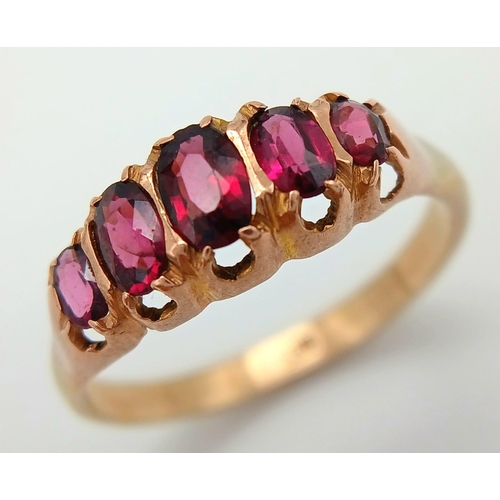 728 - Impressive 9 carat GOLD RING having 5 x RED GEMSTONES oval cut and Mounted to top. Complete with rin... 