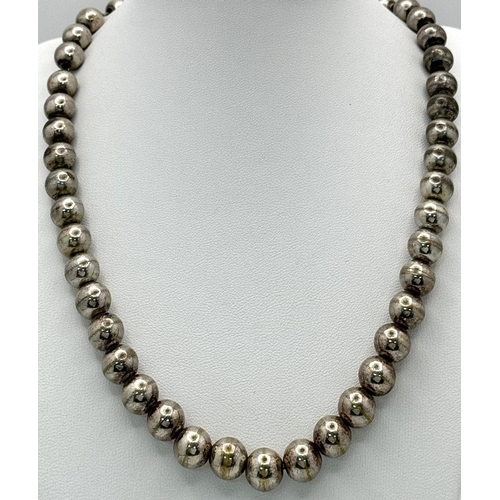 1116 - A Heavy Chromium Beaded Necklace. 10mm beads. 42cm length.