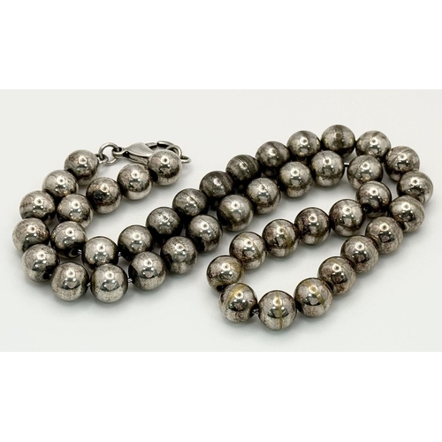 1116 - A Heavy Chromium Beaded Necklace. 10mm beads. 42cm length.