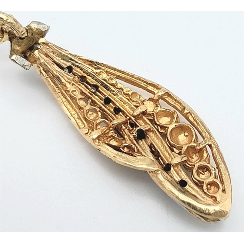 1175 - An 18K Gold Necklace with a Hanging Leaf Form Pendant - A Line of Diamonds Separating Graduated Gold... 