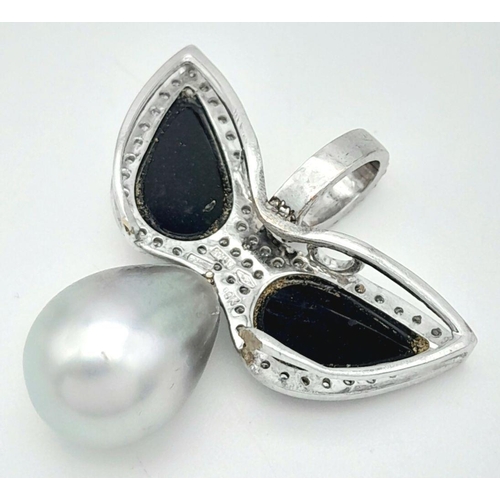 1180 - An Italian Hand-Made 18K White Gold, Diamond and Tahitian Pearl Pendant in a Dove Bird Form. Black o... 