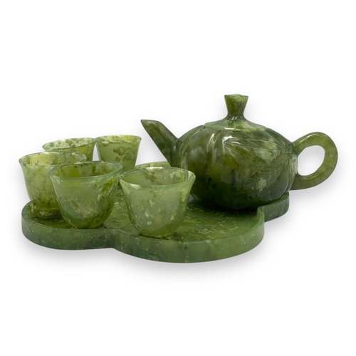 772 - An exquisite Chinese Green Jade Teapot Set. All Hand Crafted from jade, this set features a teapot a... 