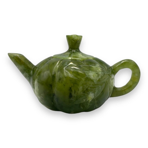 772 - An exquisite Chinese Green Jade Teapot Set. All Hand Crafted from jade, this set features a teapot a... 