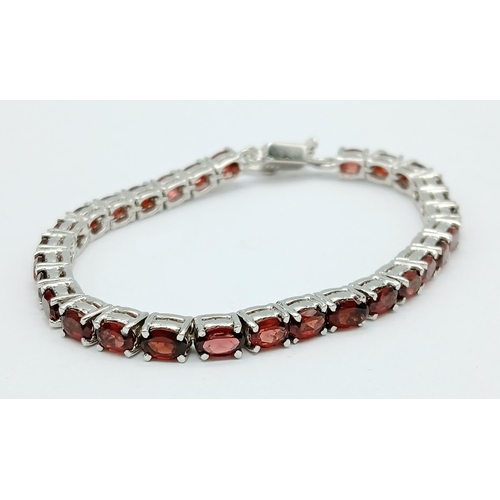 1449 - An Almandine Garnet Tennis Bracelet on 925 Silver. 32ctw. 19cm length, 21g total weight. Comes in pr... 