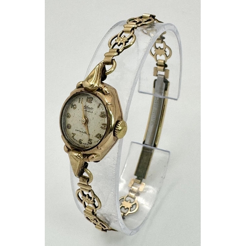 1463 - At Atlantic 9K Gold Cased Ladies Watch. Mechanical movement. Works but because of age no guarantees.