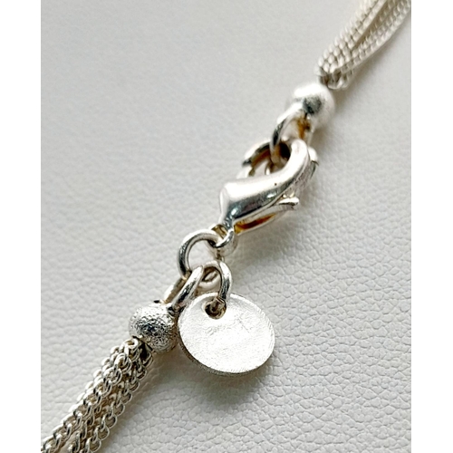 1235 - A Six Row Sterling Silver Necklace. 17g. 42cm.