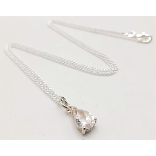 1244 - A Sterling Silver CZ Pendant on a Sterling Silver Chain. 1cm and 48cm.