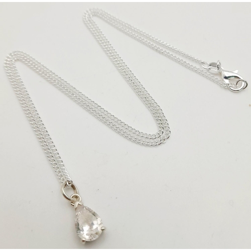 1244 - A Sterling Silver CZ Pendant on a Sterling Silver Chain. 1cm and 48cm.