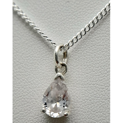 1244 - A Sterling Silver CZ Pendant on a Sterling Silver Chain. 1cm and 48cm.