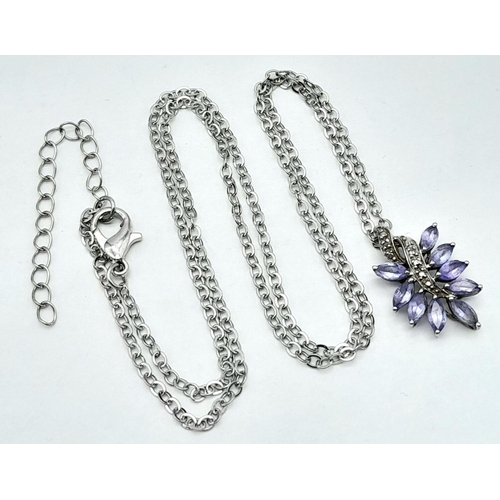 1249 - An Amethyst and Silver Pendant on a White Metal Chain Necklace. 2cm and 42cm.