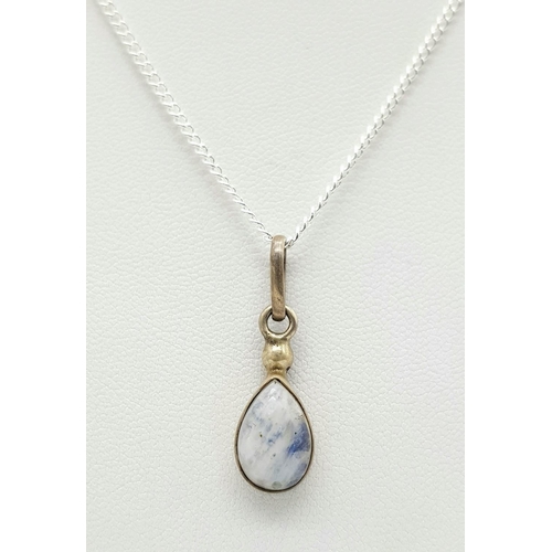 1265 - A Stone Set Silver Pendant on a Silver Chain. 2cm and 48cm.