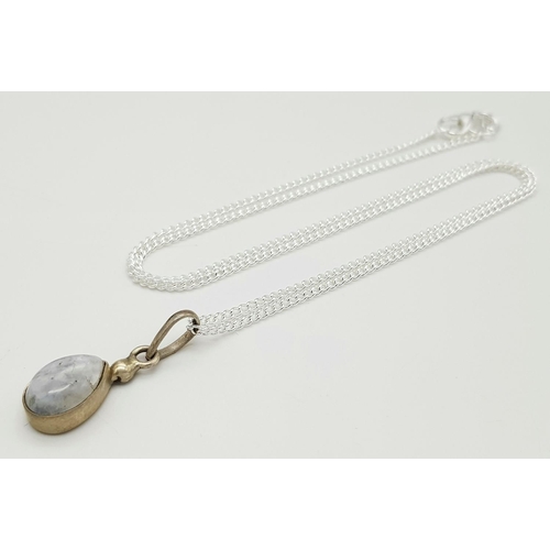 1265 - A Stone Set Silver Pendant on a Silver Chain. 2cm and 48cm.