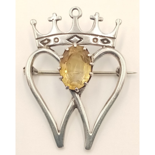 1459 - A Sterling Silver and Citrine Scottish Luckenbooth Brooch. 4cm