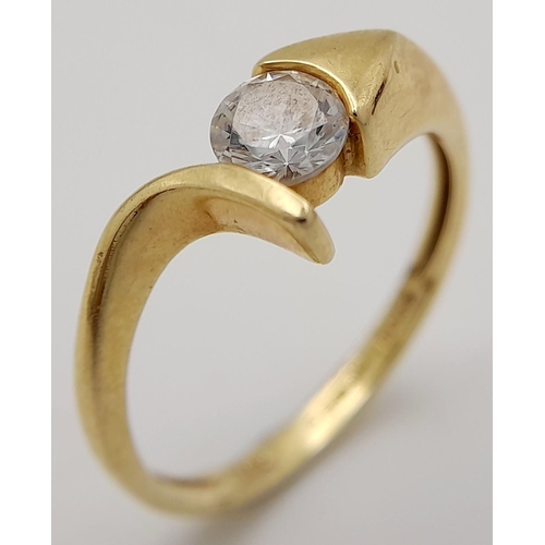 21 - Attractive 14 carat gold ring in modernist crossover style