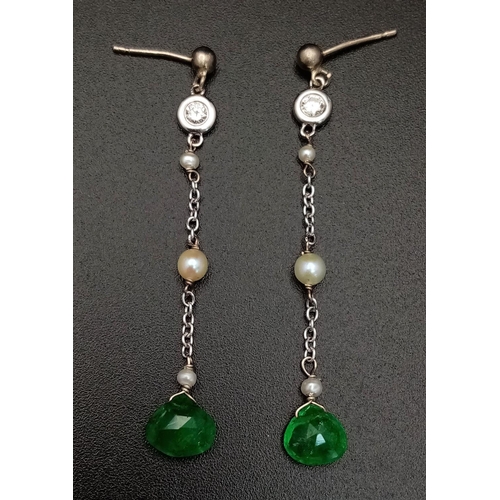 323 - A PAIR OF EMERALD AND SEED PEARL DROP EARRINGS IN 9K WHITE GOLD .         1.5gms