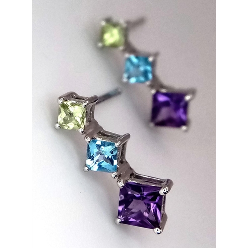 337 - A PAIR OF 18K WHITE GOLD EARRINGS WITH CITRINE, TOPAZ AND AMETHYST STONES .   1.6gms