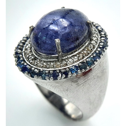 618 - An 8ct Tanzanite Gemstone Ring with 0.95ctw of Blue Sapphire Surround. Set in 925 Silver, Diamond we... 