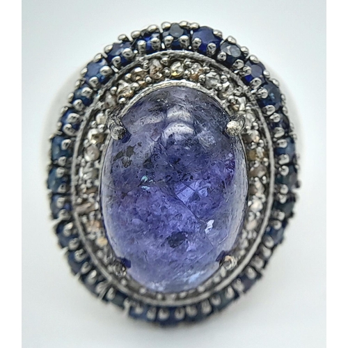 618 - An 8ct Tanzanite Gemstone Ring with 0.95ctw of Blue Sapphire Surround. Set in 925 Silver, Diamond we... 