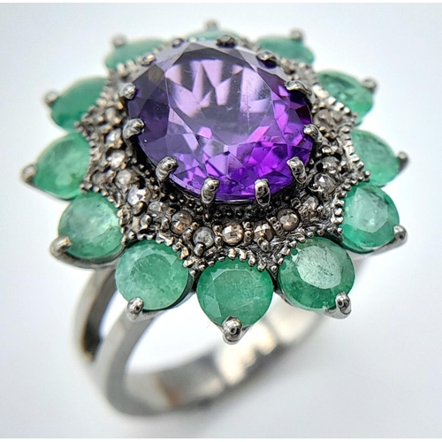 914 - An Amethyst Gemstone Ring with Emerald Accents. Centre stone approx 3ct. Emerald weight 2.7ct. Set i... 