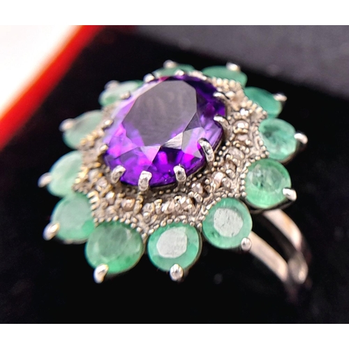 914 - An Amethyst Gemstone Ring with Emerald Accents. Centre stone approx 3ct. Emerald weight 2.7ct. Set i... 