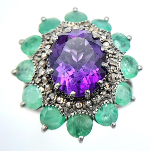 914 - An Amethyst Gemstone Ring with Emerald Accents. Centre stone approx 3ct. Emerald weight 2.7ct. Set i... 