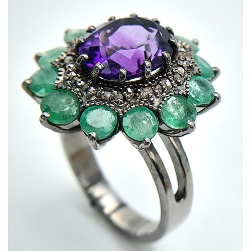 914 - An Amethyst Gemstone Ring with Emerald Accents. Centre stone approx 3ct. Emerald weight 2.7ct. Set i... 