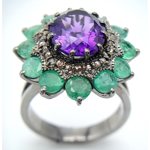 914 - An Amethyst Gemstone Ring with Emerald Accents. Centre stone approx 3ct. Emerald weight 2.7ct. Set i... 