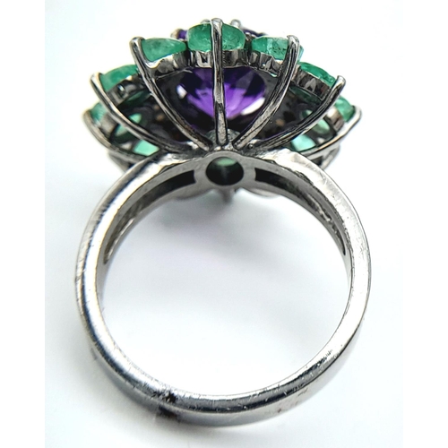 914 - An Amethyst Gemstone Ring with Emerald Accents. Centre stone approx 3ct. Emerald weight 2.7ct. Set i... 