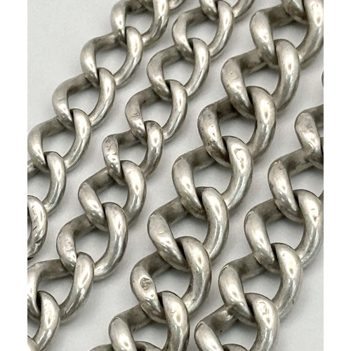 1104 - A silver double Albert watch chain with T-bar and secure links. 52.5cm length and 37g in weight.