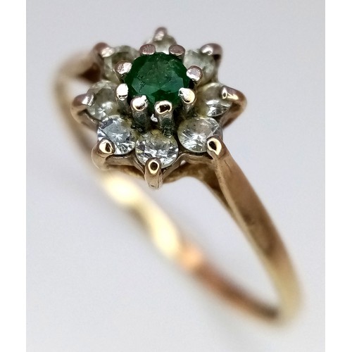 619 - A 9K Yellow Gold Green and White Stone Ring. Size M. 1g total weight.