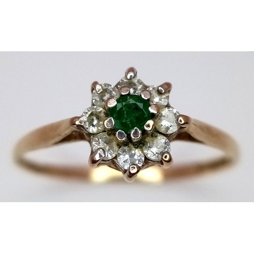 619 - A 9K Yellow Gold Green and White Stone Ring. Size M. 1g total weight.