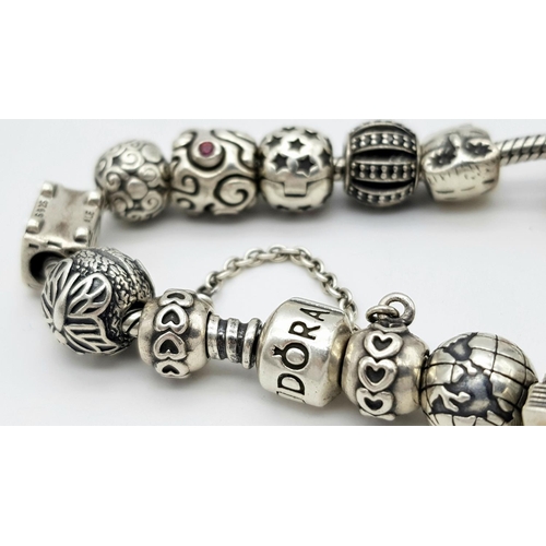 1118 - A Pandora Sterling Silver Charm Bracelet. 18 charms with multiple S25 ALE markings. 16cm. 71g