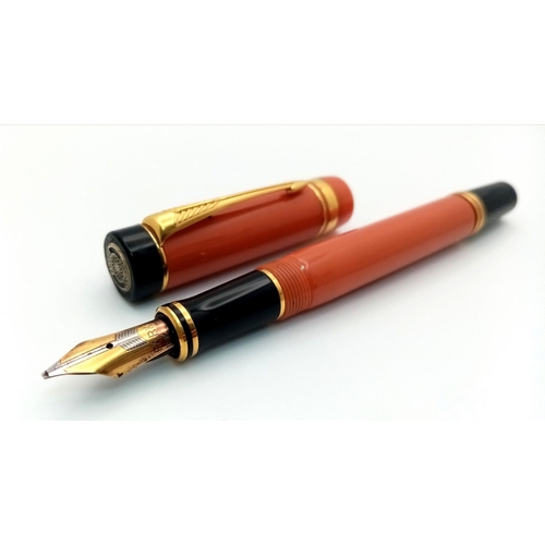 1165 - A Parker Orange Lacquer Fountain Pen. 18k gold nib.