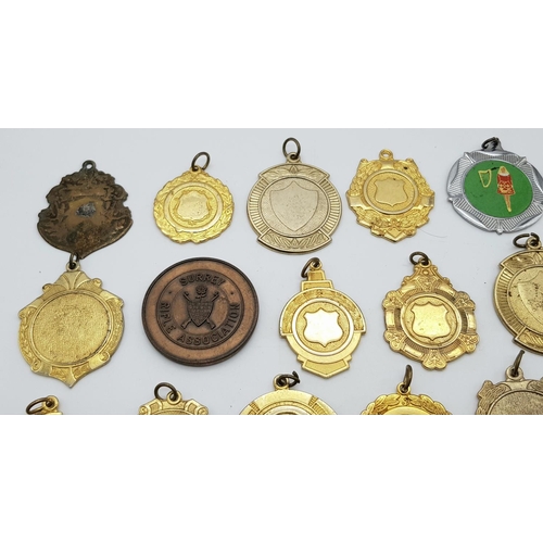 1264 - An assortment of medals, fobs, and badges.