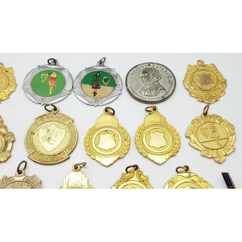 1264 - An assortment of medals, fobs, and badges.