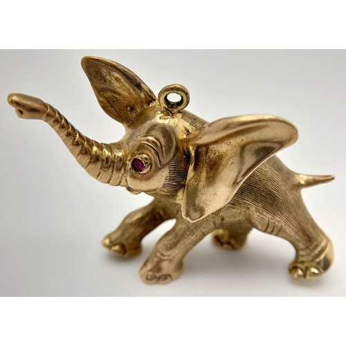 274 - A Wonderful 9K Yellow Gold Elephant Pendant with a Ruby Eye! 4cm. 13.2g