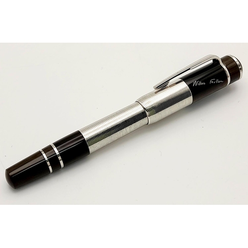 486 - A Montblanc William Faulkner Limited Edition Fountain Pen. 18K gold nib. Dark brown resin and platin... 