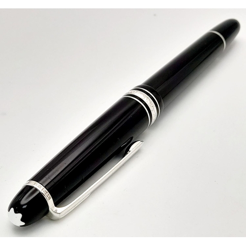 976 - A Montblanc Meisterstuck Fountain Pen. Black lacquer and silver tone decoration. 14k gold nib. 14cm.